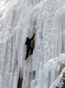 A climber top ropes a steep and chandeliered curtain of ice in the Ouray Ice Park.