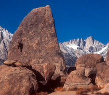 Climbing in the Alabama Hills with Mount Whitney in the background.