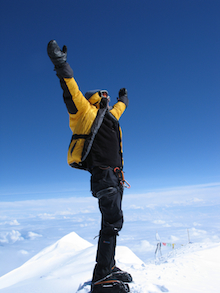 An ecstatic climber at the summit of Denali.