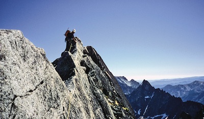 A climber enjoying the phenomenal exposure on the N. Ridge of Mt. Stuart