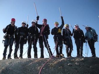 A Leaders of Tomorrow group celebrates on the summit of Mt. Baker.